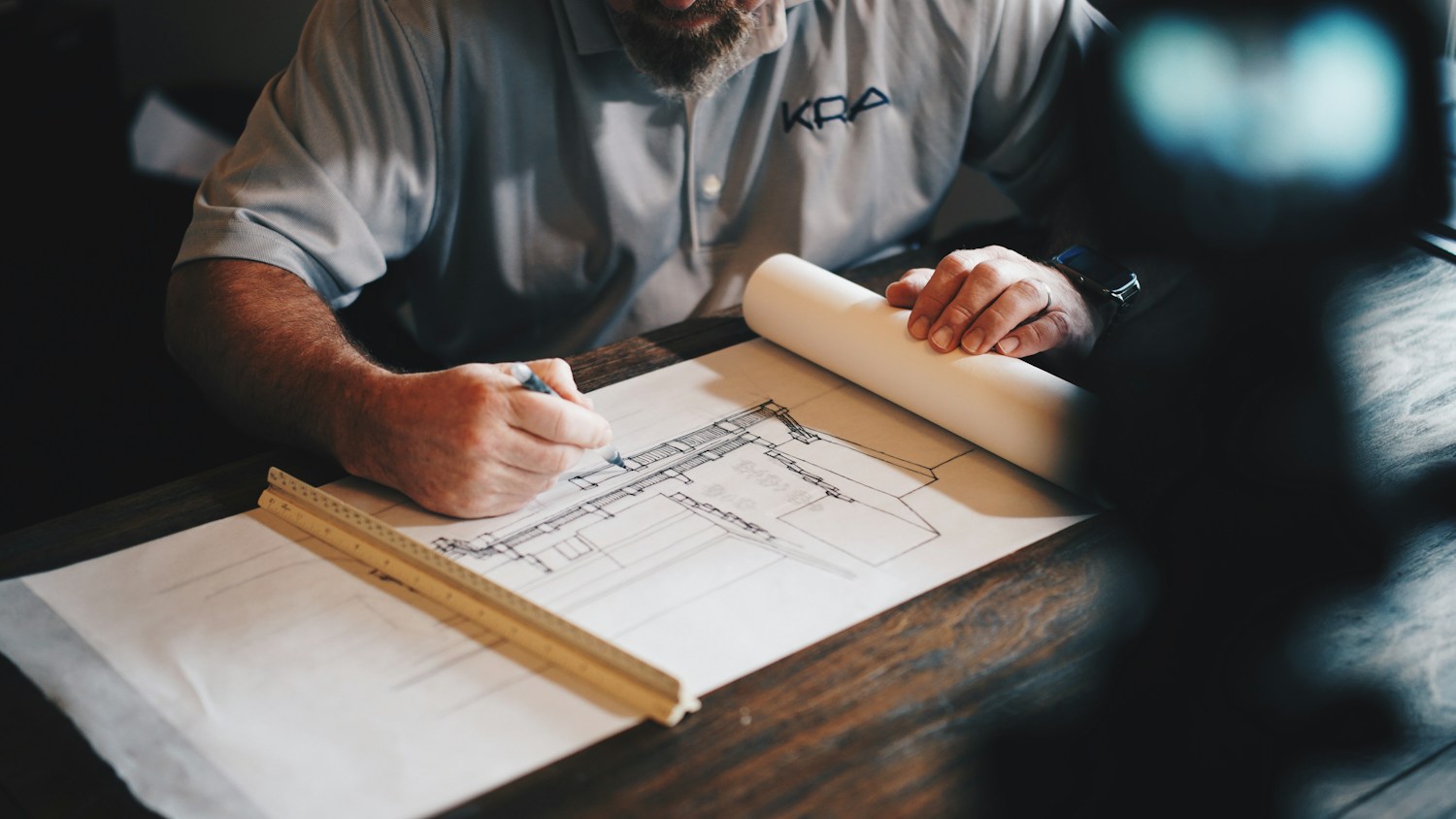 Professional reviewing architectural drawings